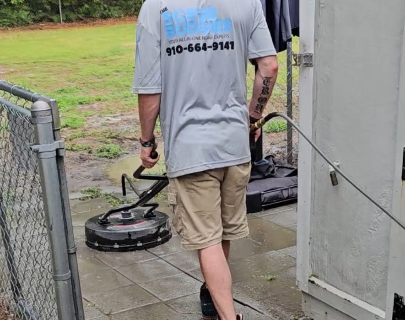 A The Scrub Buddies team member performing pressure washing in Brunswick County, NC, demonstrating improved exterior cleanliness and visual appeal.