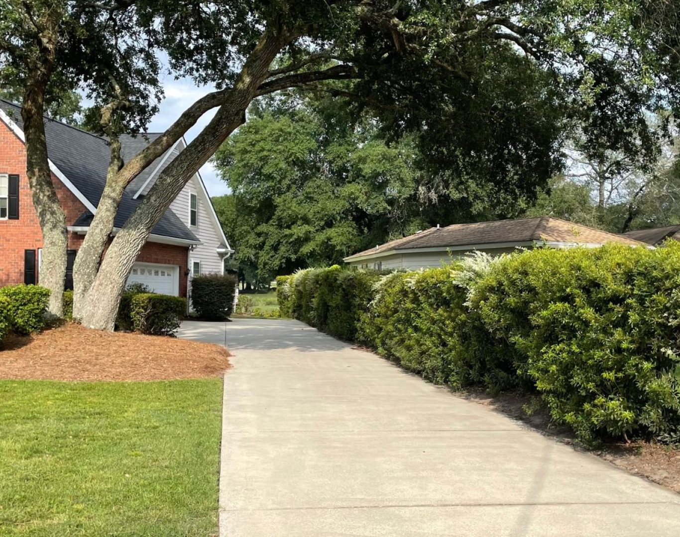 A The Scrub Buddies technician working on a Brunswick County, NC property, showcasing safe and effective pressure washing techniques. Pressure Washing near me.
