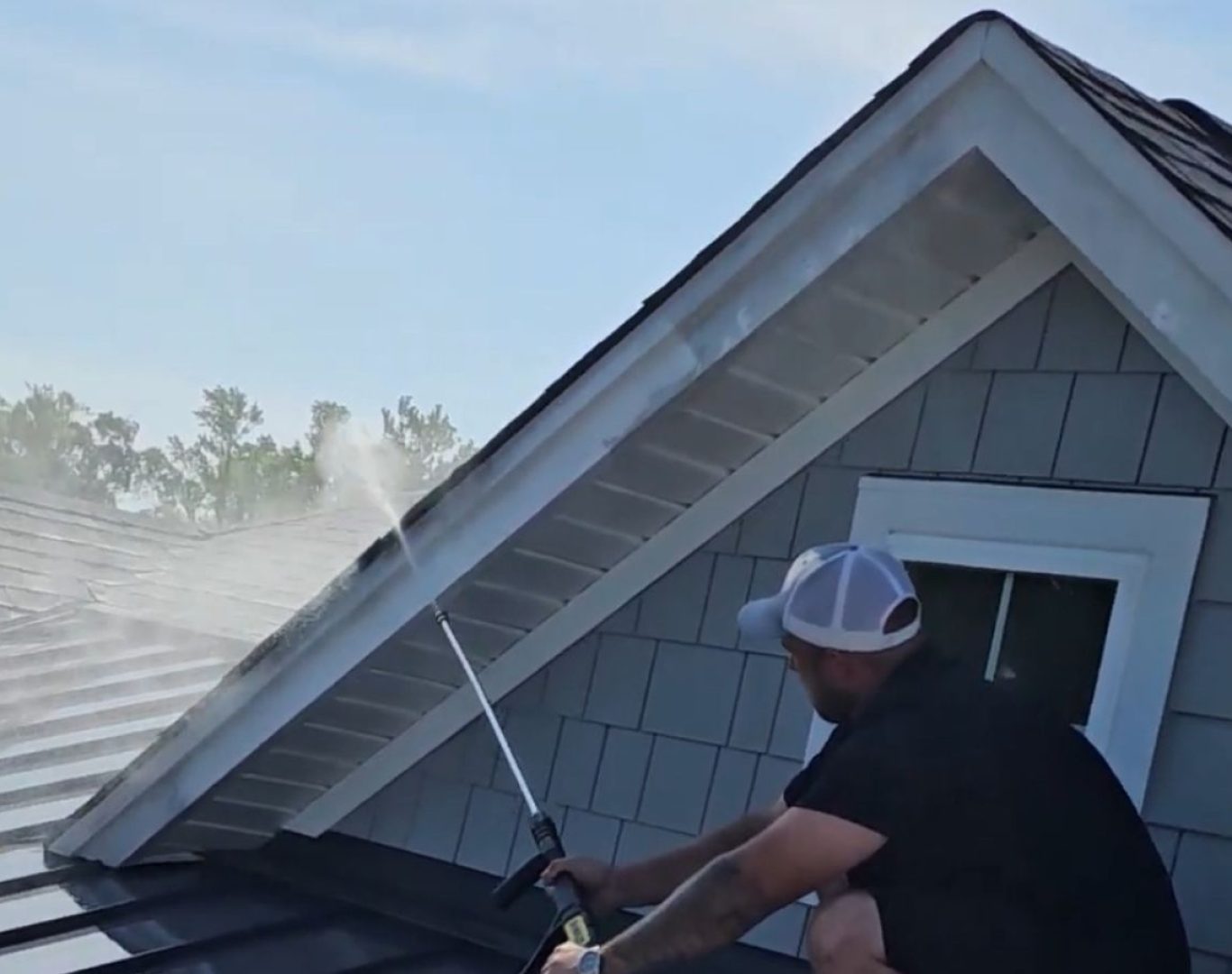 A The Scrub Buddies expert performing pressure washing in Supply, NC, highlighting quality care and efficiency for local home exteriors. Pressure Washing near me.